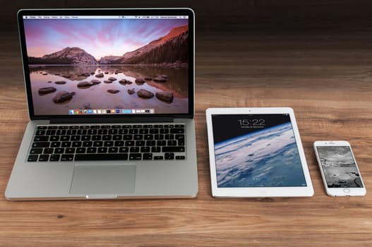 Photo of MacBook, iPad, and iPhone.